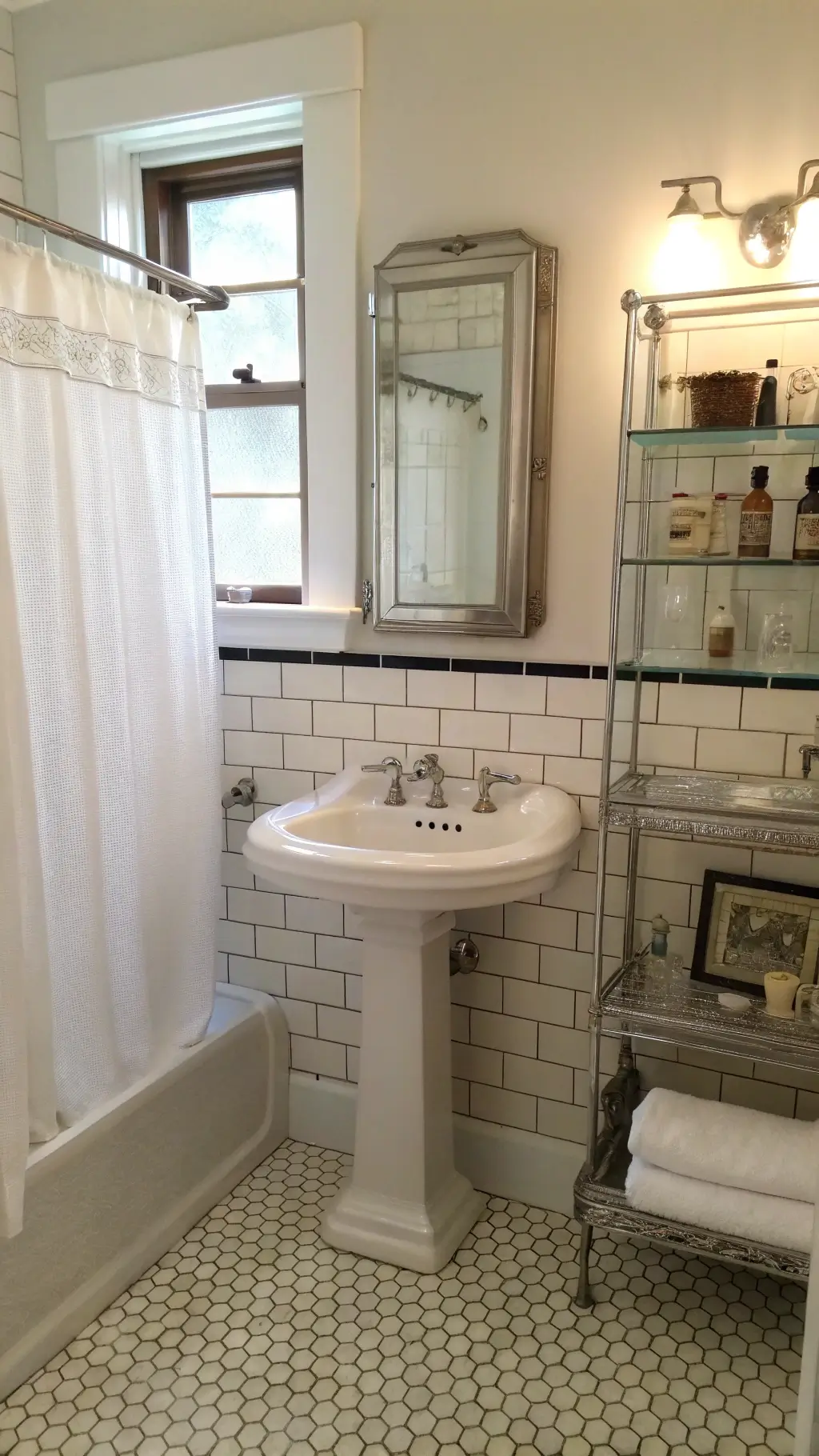 Elegant 1920s bathroom with subway tiled walls, basketweave floor, pedestal sink, built-in medicine cabinet, and heritage details; soft lighting and linen curtains adding to its classic atmosphere.